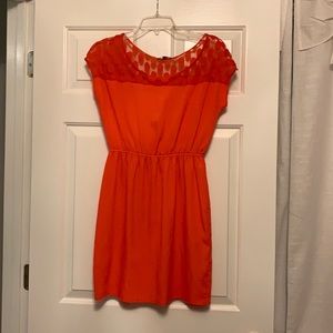 Orange dress with illusion neckline